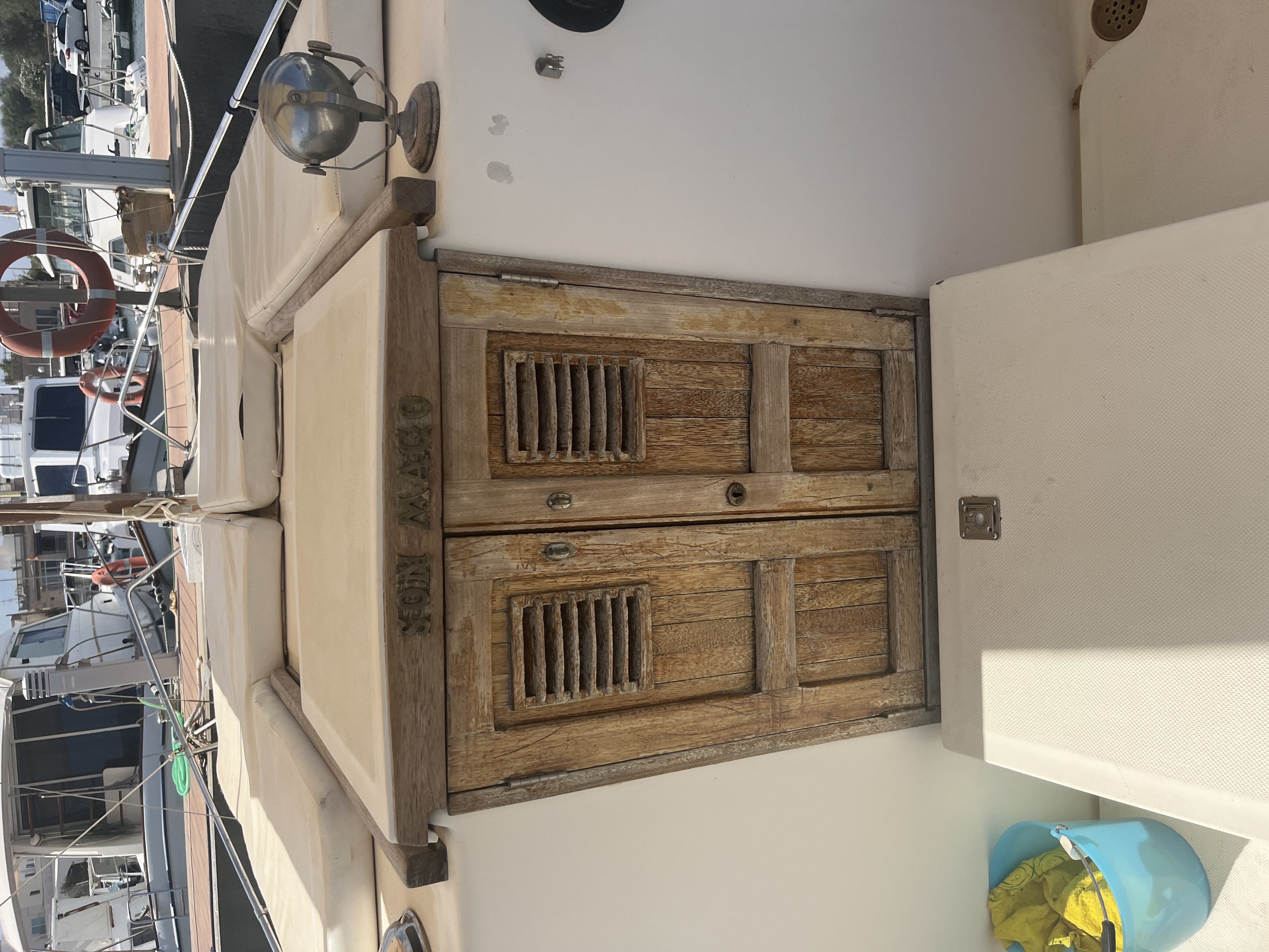 Weathered companionway doors before sanding and oil treatment.